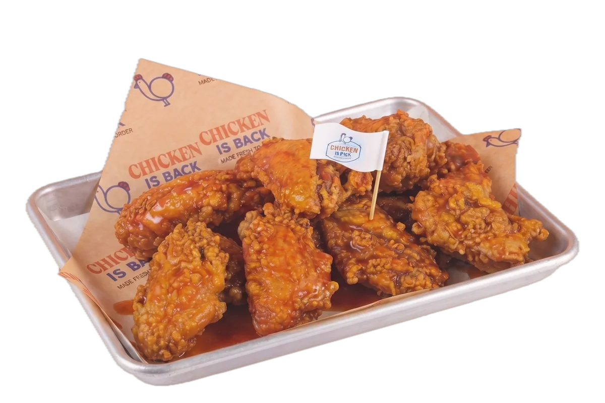 Red Pepper wings on a tray at Chicken Is Back