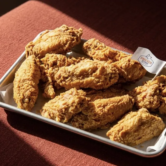 A tray of plain crispy wings in afternoon light